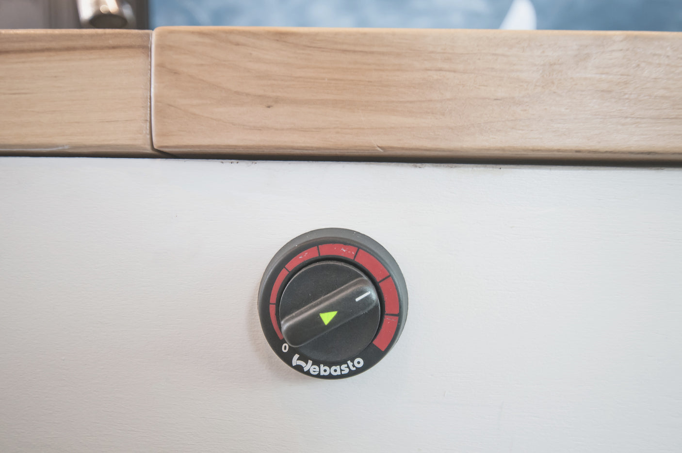 Close-up of a Webasto heater control dial inside an RV rental, currently set to off. Ensures comfort for your journey.