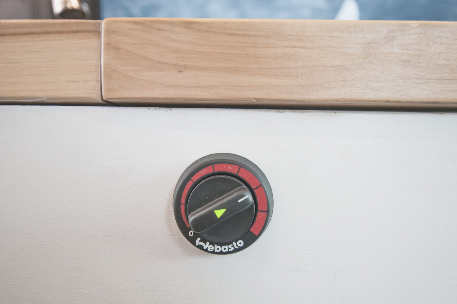 Close-up of a Webasto heater control dial inside an RV rental, currently set to off. Ensures comfort for your journey.