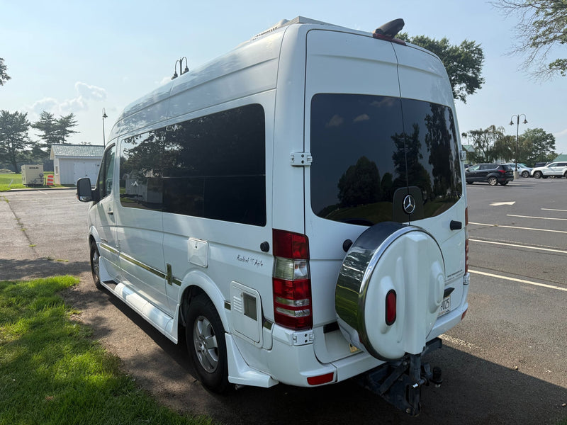  seen parked in sunny weather.|White Roadtrek SS Agile RV rental camper van — photo 4