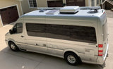 Silver Airstream Interstate RV rental, a luxury camper van with rooftop solar panels and AC units.