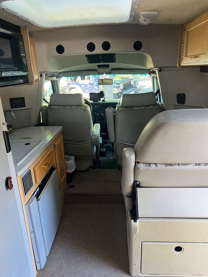  ideal for road trip adventures.|RV rental interior shows a kitchenette — photo 6