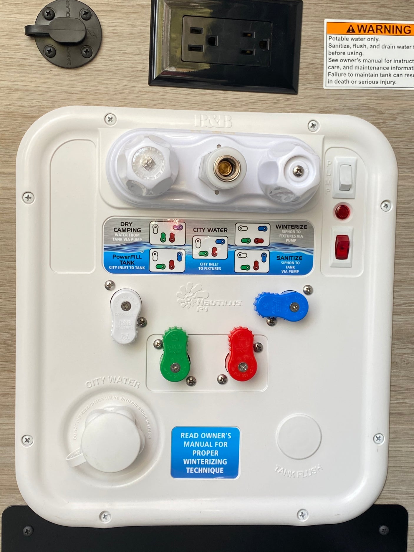 An RV rental's Nautilus P3 water control panel, detailing fill, sanitize, winterize functions, plus power outlets and solar hookup.