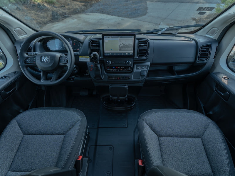 Interior view of an RV rental van's cockpit, featuring the modern dashboard, infotainment screen, and front seats. — photo 10