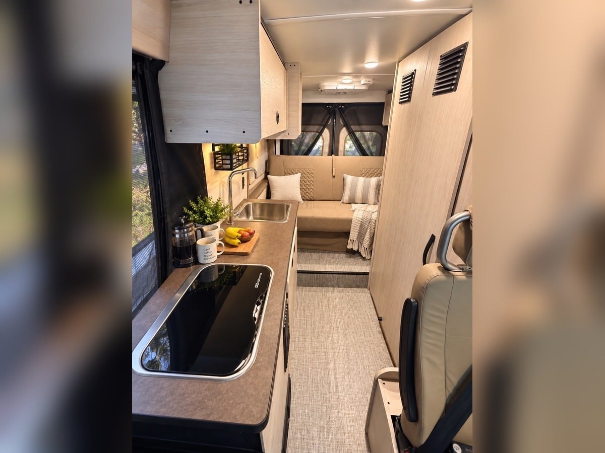  ideal for a new adventure.|Modern rv rental interior with a bright kitchen — photo 5