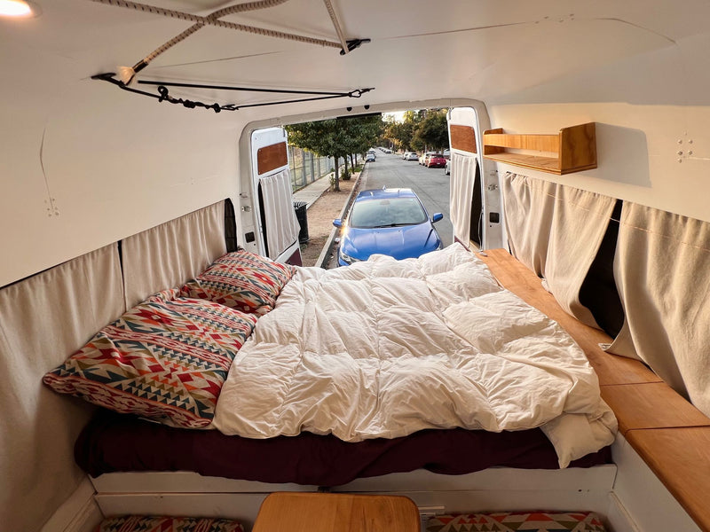  and vibrant patterned seating.|This comfy camper van interior — photo 11