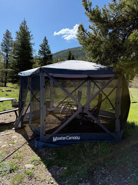 MasterCanopy screen house at a scenic campsite, perfect for RV rental adventurers seeking bug-free outdoor dining.
