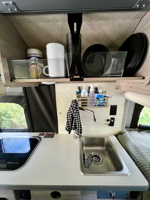  and wall controls in this compact camper van.|Spacious RV rental interior: swivel front seats — photo 9