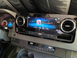 RV rental dashboard with high-tech infotainment playing SiriusXM, showing 43k miles and climate settings.
