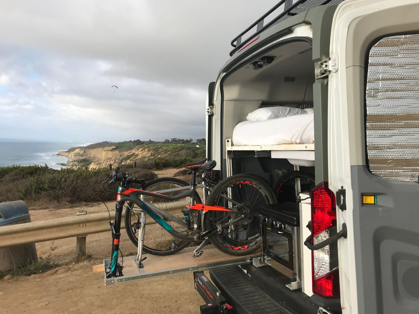  & bike space. View of golf course.|RV rental trip! Friends enjoy outdoor cooking & coffee by their camper van. One waves from the ladder — photo 21