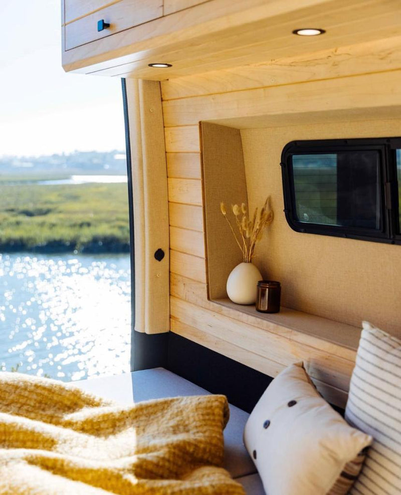  parked by a river.|Customized black & light-colored Mercedes Sprinter van — photo 4