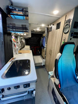 Explore a compact rv rental camper van interior: equipped kitchen, smart storage, and cozy seating for your next mobile adventure.