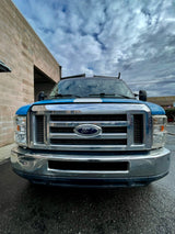 Front view of a blue Ford utility truck. Explore our other rental options, including RV rental for your adventures.