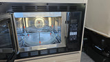 Inside an **rv rental**, an open **microwave oven** reveals its interior and control panel, highlighting multi-functional cooking.
