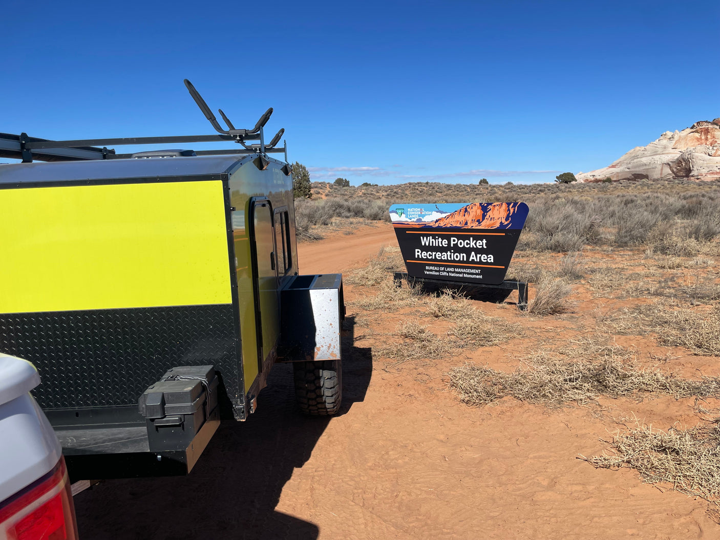 RV rental trailer at the White Pocket Recreation Area sign, Bureau of Land Management, Vermilion Cliffs National Monument.
