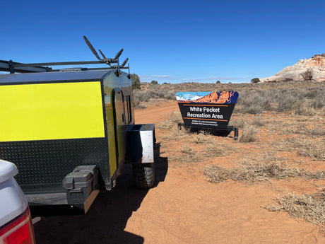 RV rental trailer at the White Pocket Recreation Area sign, Bureau of Land Management, Vermilion Cliffs National Monument.