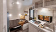 Cozy RV rental interior with a compact kitchen