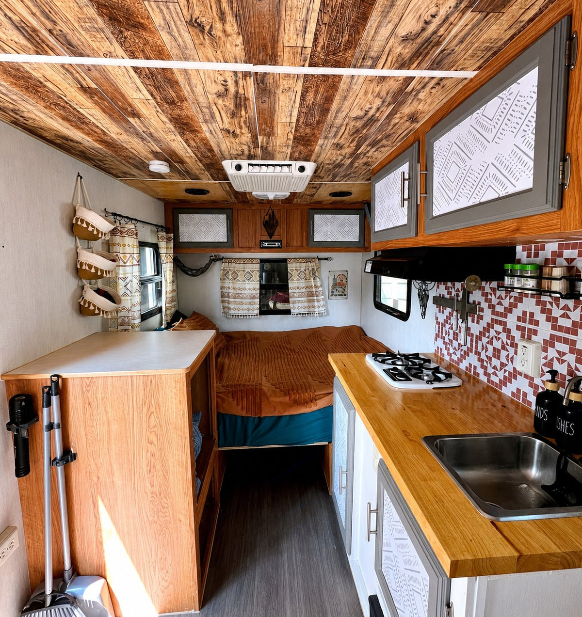 Step into this cozy RV rental with its stylish wood ceiling