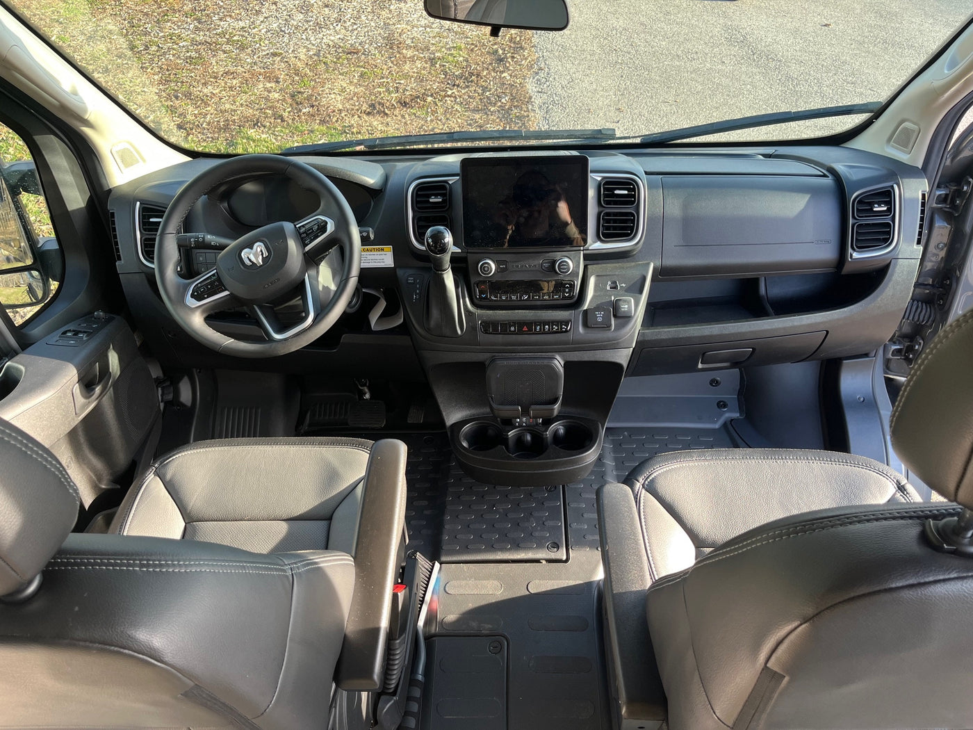 Spacious RV rental cockpit with modern dashboard, large infotainment screen, and comfortable seating, ideal for road trips. — photo 12