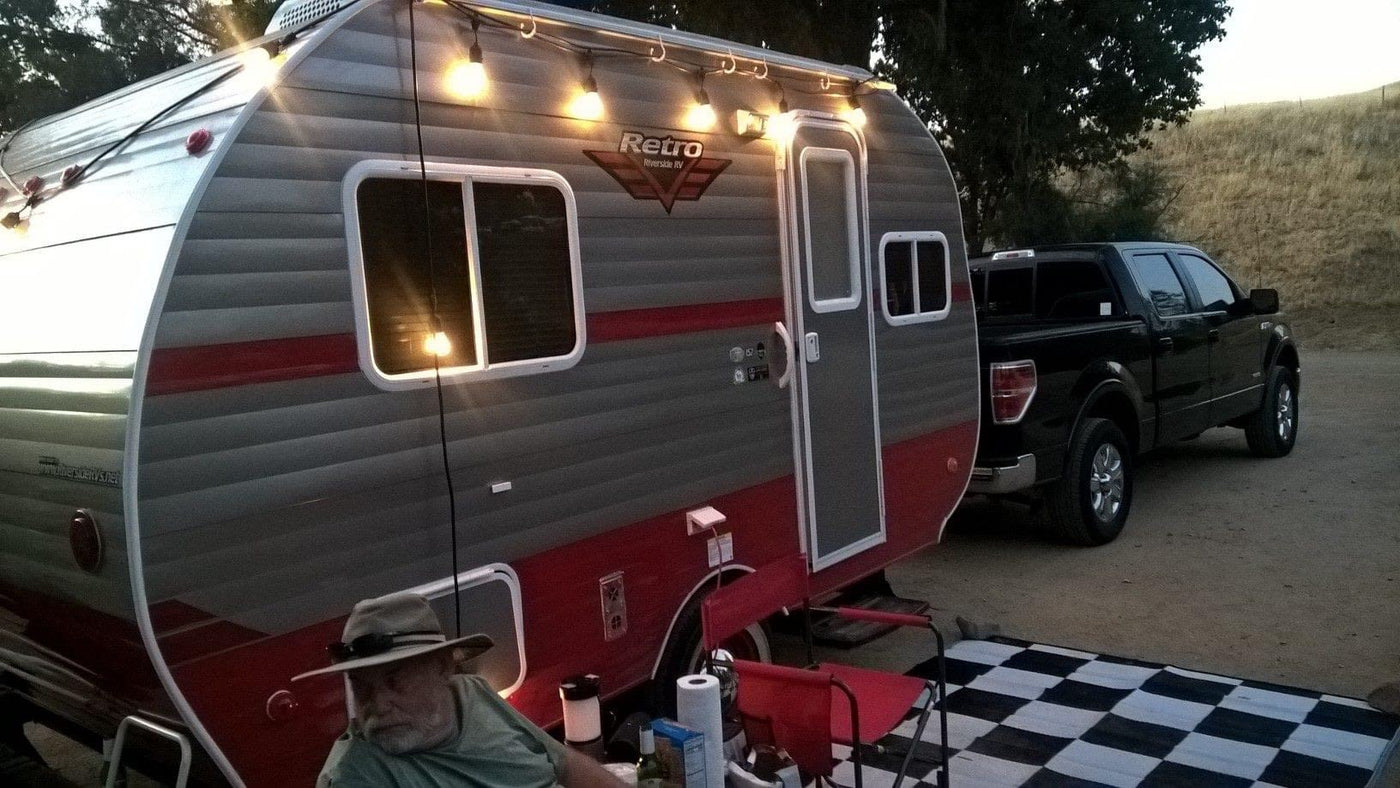  and checkered floor. Pet food bags are on the floor.|Inside this **rv rental** — photo 6