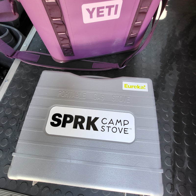  parked in a forest campsite. Ideal RV rental for outdoor adventures.|Experience van life with this cozy rv rental! Interior shows a bed — photo 19