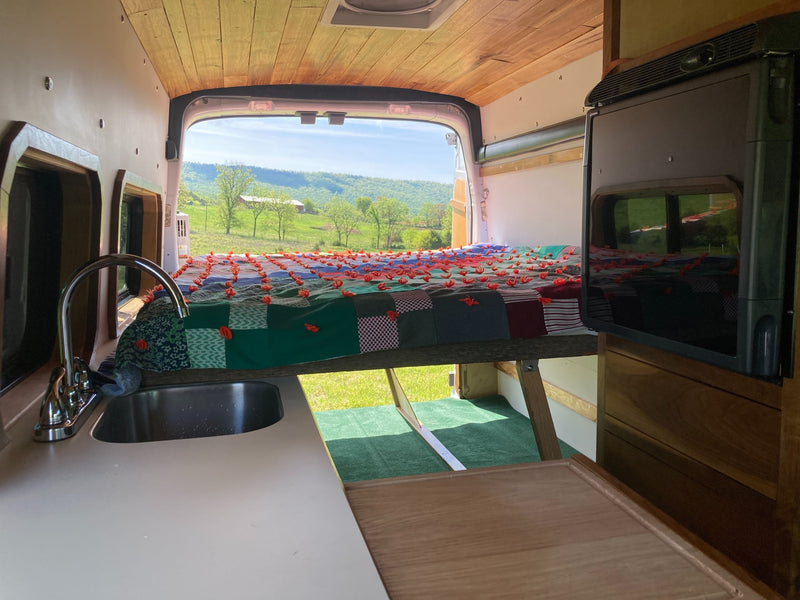  and an outdoor water heater.|Inside an RV rental: two gray passenger seats with seatbelts — photo 9