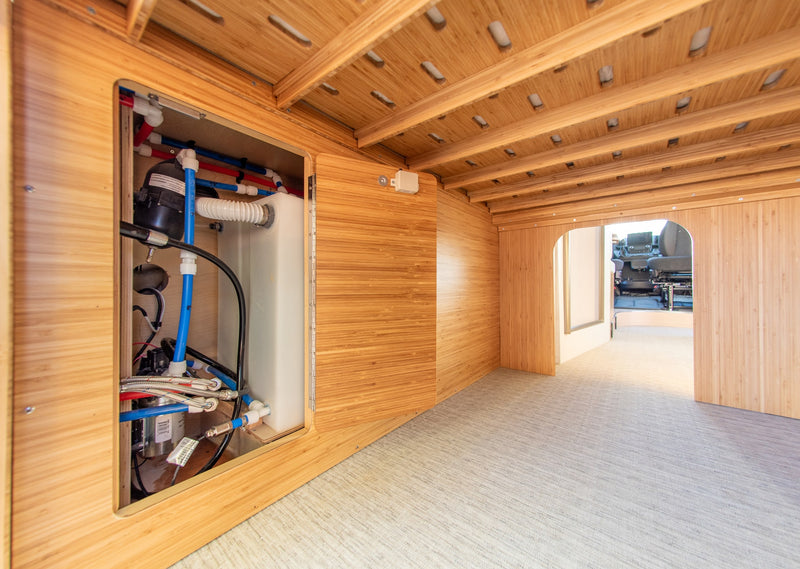  and cozy bed. Light wood and cream accents create a bright space.|Bright RV rental interior: integrated kitchen with sink — photo 19