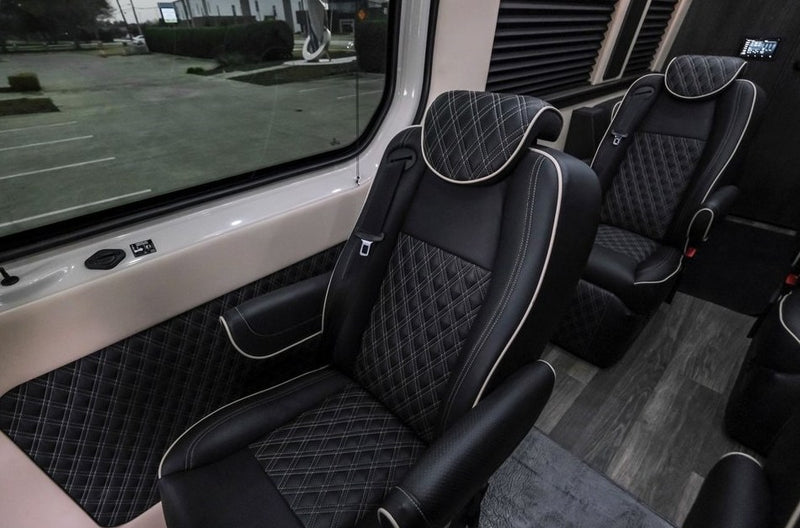  featuring a large gray LetsGoAERO cargo box and roof rack for extra storage.|Matte black custom Sprinter van — photo 12