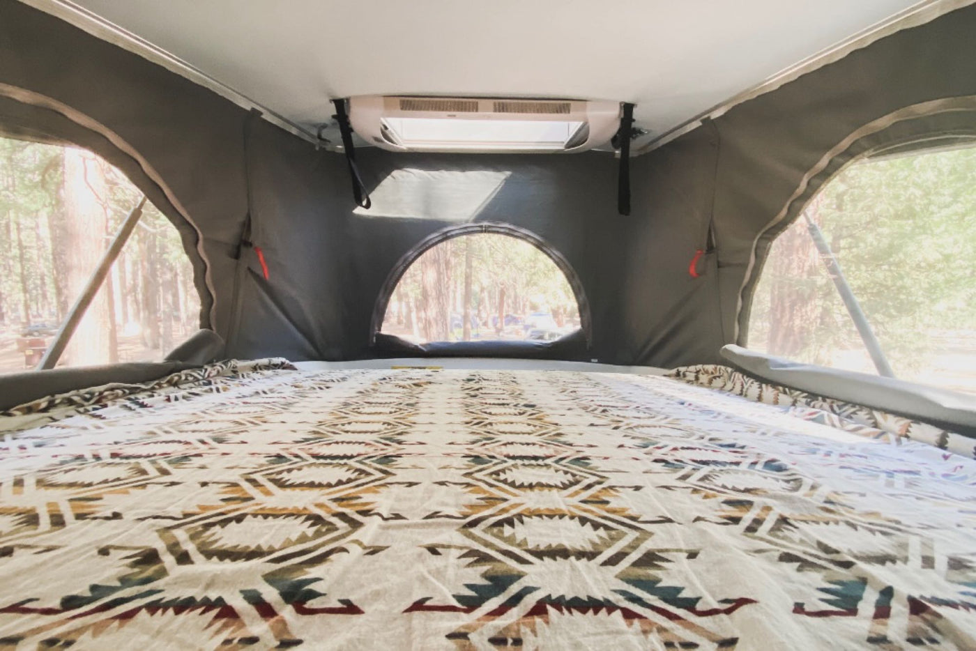  parked in the woods.|Relaxing at a forest campsite with an RV rental — photo 8