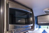 RV rental interior: Built-in microwave for easy meal prep on your journey.