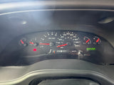 An RV rental's dashboard with speedometer at 0 mph, fuel tank nearly full, odometer showing 95,260 miles, and the BRAKE warning light on.