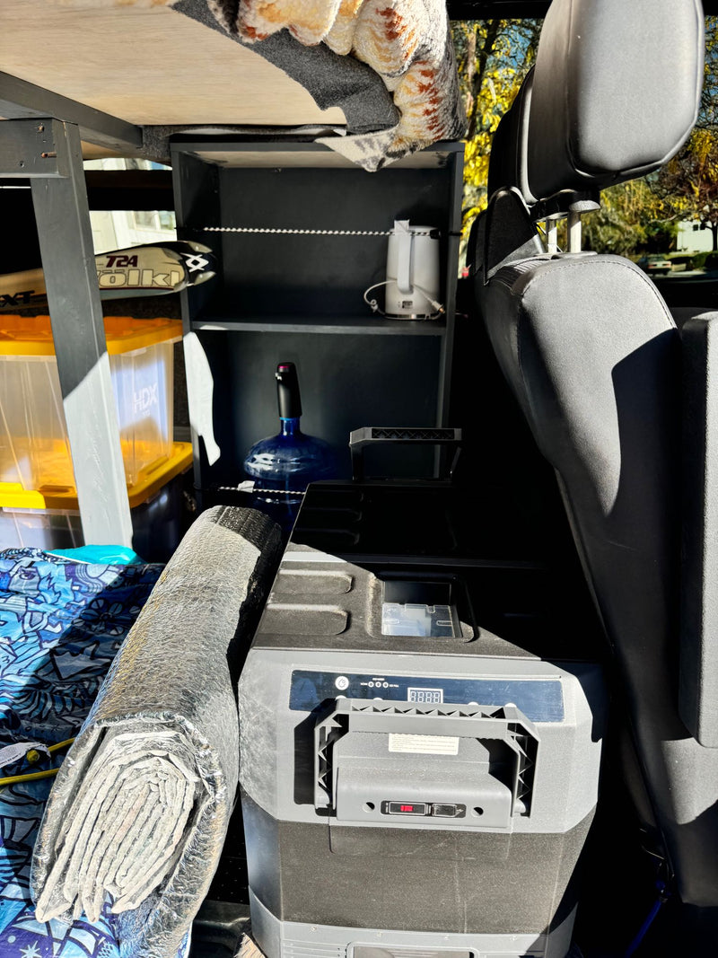  beside a vehicle seat. Practical for trips.|Inside an RV rental Sprinter van: driver's area with tablet mount — photo 13