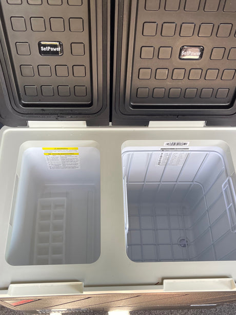 Open SetPower dual-zone portable fridge/freezer, ideal for rv rental trips. Features separate compartments & ice tray.