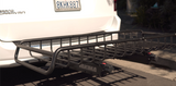 RV rental: Rear of a white Chrysler Grand Caravan with a black Yakima cargo hitch basket for extra storage.