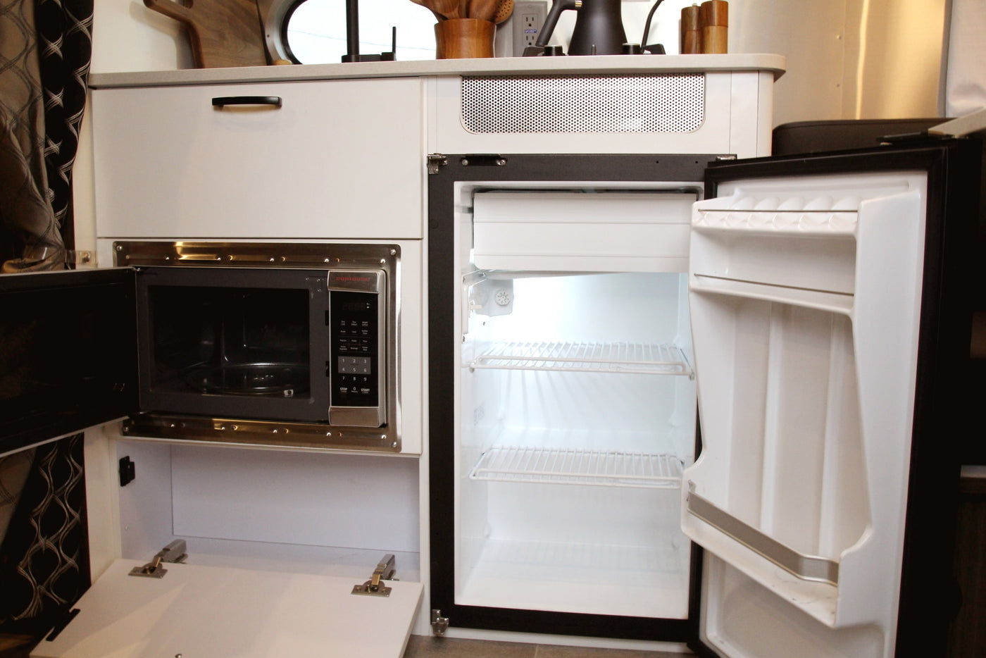  and a comfy bed with cozy blankets.|Cozy RV rental interior: A bed with faux fur & pillows — photo 17