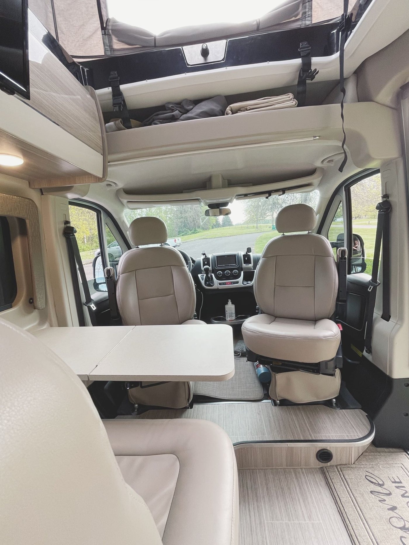 and "Welcome" mat. Perfect for travel.|RV rental's compact kitchen with a Dometic gas stove — photo 14