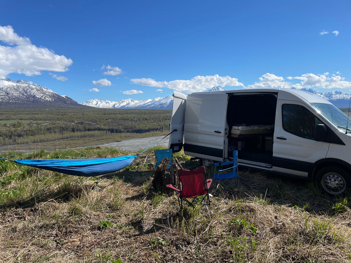  ideal for van life camping.|Cozy RV rental outdoor view: person nestled in foreground — photo 7