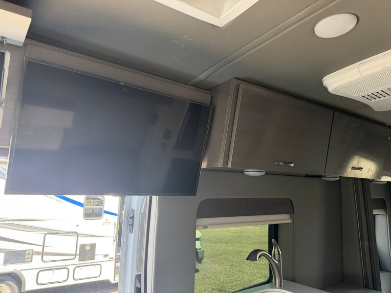  and ample storage for travel comfort.|Modern rv rental interior: kitchenette (sink — photo 8