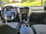Modern Toyota car interior, featuring dashboard, steering wheel, and infotainment display for your rv rental journey.
