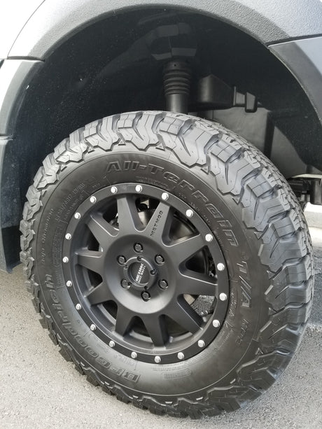 Rugged BFGoodrich All-Terrain T/A KO2 tire and black Method wheel on an RV rental.