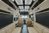Luxury rv rental interior with plush seating, wood accents, and ambient lighting.