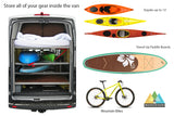 Inside an RV rental van, showcasing multi-level storage for kayaks, paddle boards, and mountain bikes.