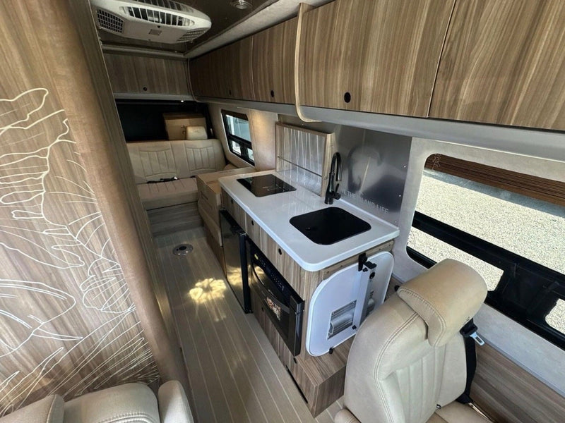  sunny trees.|Mercedes Sprinter RV rental with awning extended — photo 5
