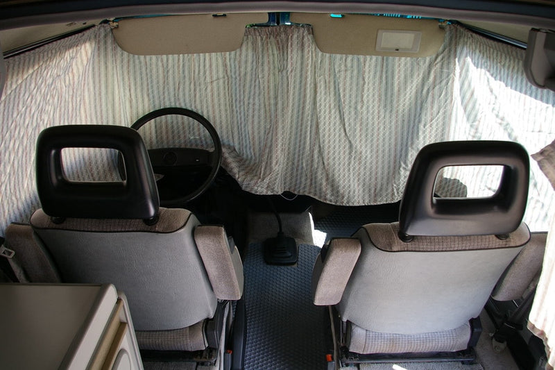  showing dashboard & side mirror reflecting street & home. Great for an rv rental.|RV rental: VW van interior — photo 11