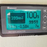 Renogy battery monitor showing 399Ah, 100% charge, 13.7V, -0.58A, 7W. Essential for rv rental power management.