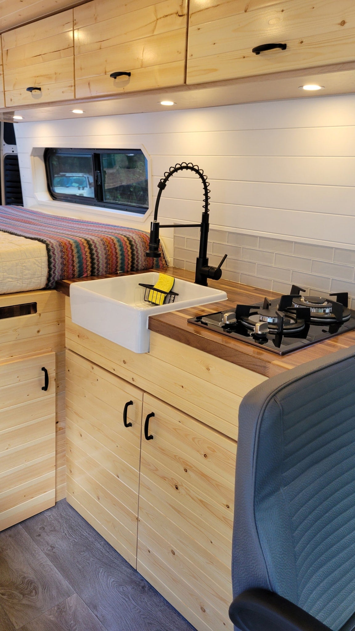  ready for adventure.|Modern RV rental interior with wood cabinetry — photo 19
