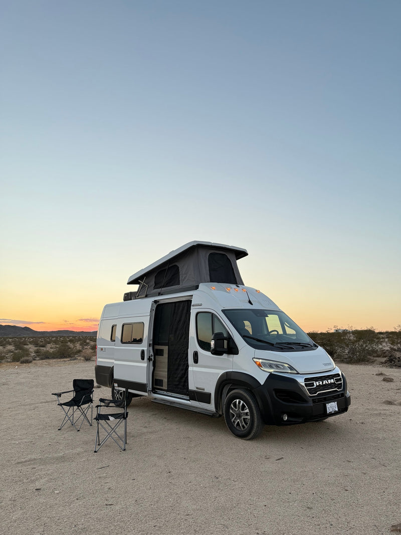  and driver's cockpit. Perfect for road trips and adventure.|Enjoying a serene desert sunset from an RV rental pop-top camper van — photo 10