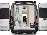 This RV rental's open rear shows a functional wet bath with toilet/shower and built-in cabinetry, ready for adventure.