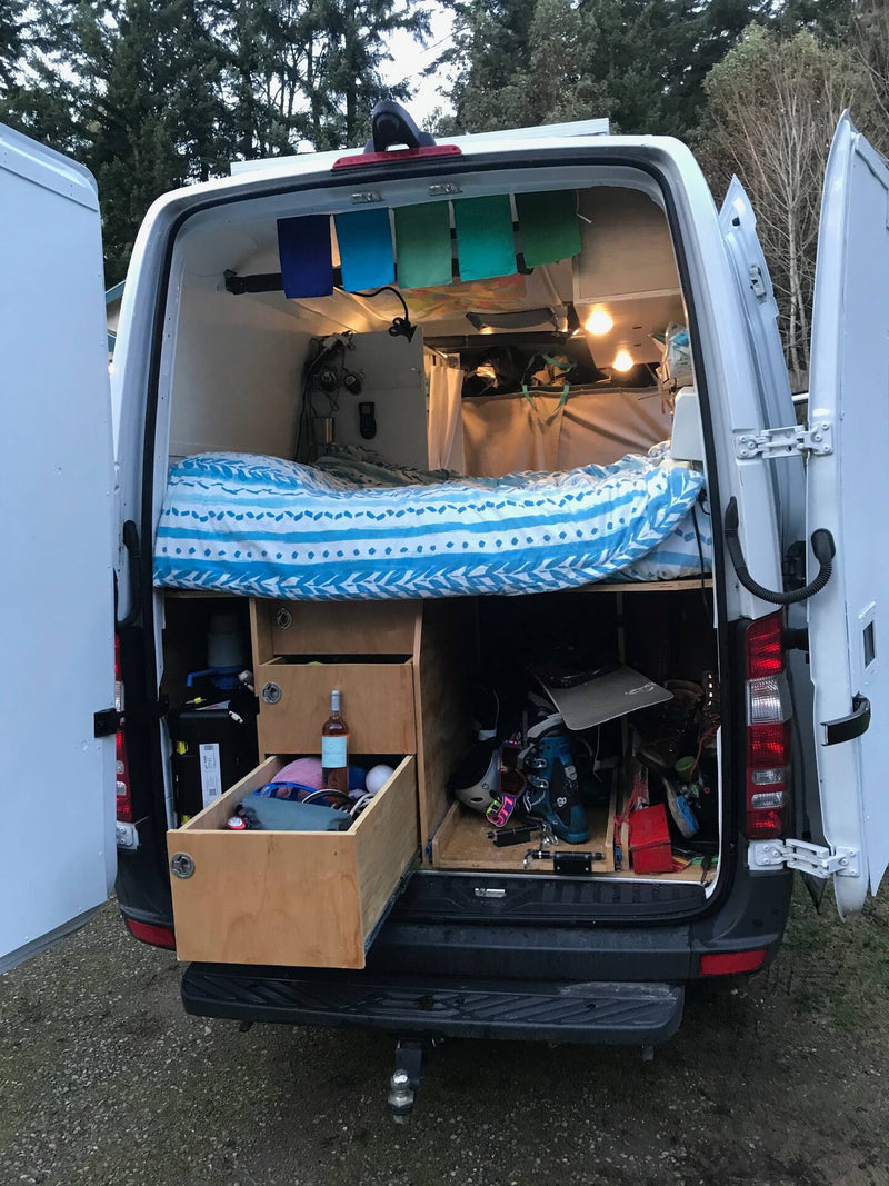  and clever storage.|Step into this custom RV rental's camper van interior — photo 9