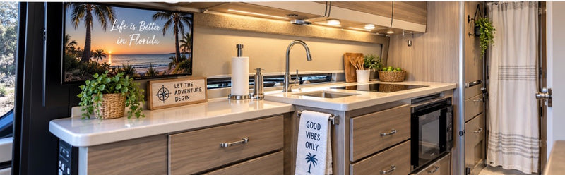  parked on sand with palm trees and ocean views.|Explore in style! This RV rental kitchen boasts modern amenities: TV — photo 2