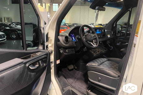 Inside a premium RV rental: Mercedes-Benz Sprinter driver's area featuring quilted leather and high-tech dashboard.
